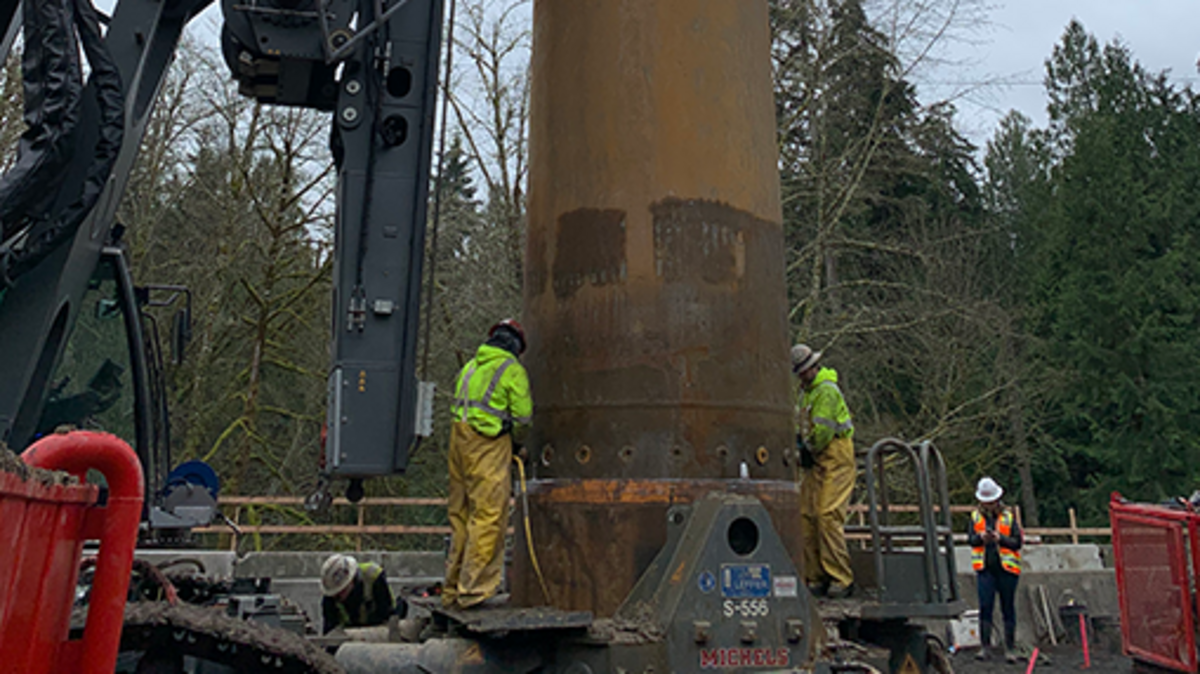 Contractors drilled four 6-foot-diameter shafts 50 feet into the ground for footings of a new bridge over Minter Creek
