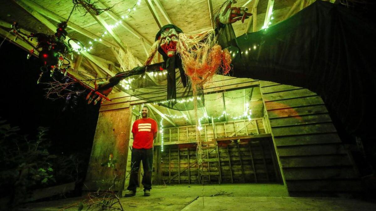 Mark Dodson stands inside the witch’s hut at the Haunted Forest at Grand Farms on Key Peninsula.