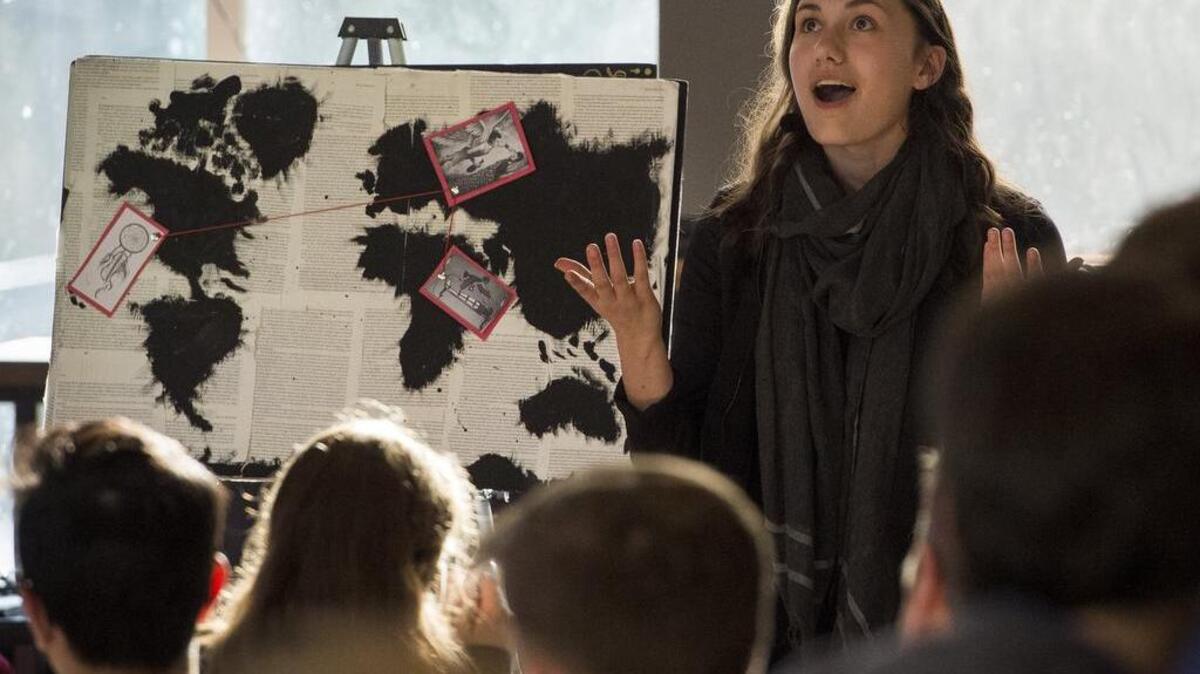 Gig Harbor High junior Emily Nold gives an expository speech about dreaming during a showcase at Markee in Gig Harbor on Monday.