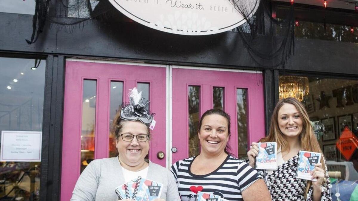 Karrie Polinsky, from left, Heidi Canda and Kaylee Overby were up bright and early Oct. 27 selling tickets and programs at Tickled Pink for the upcoming Girls Night Out event.