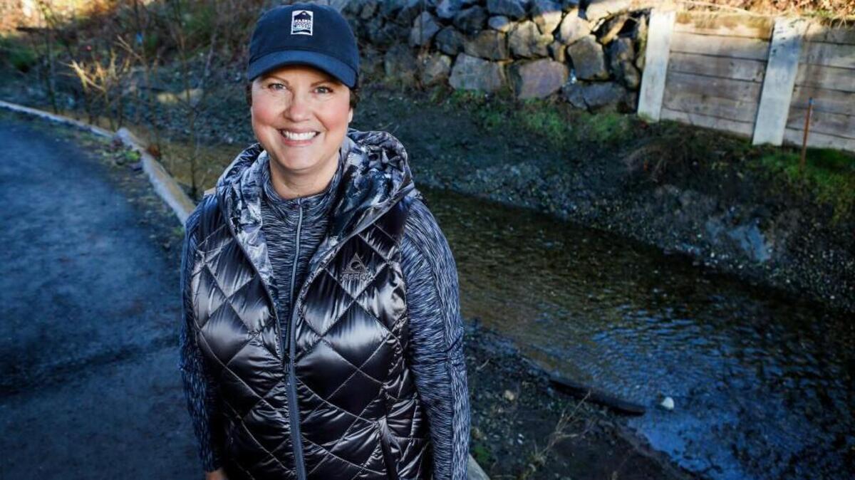 Gig Harbor City Councilmember Rahna Lovrovich stands next to Donkey Creek in Gig Harbor earlier this year. Lovrovich announced her resignation from the City Council on Monday.