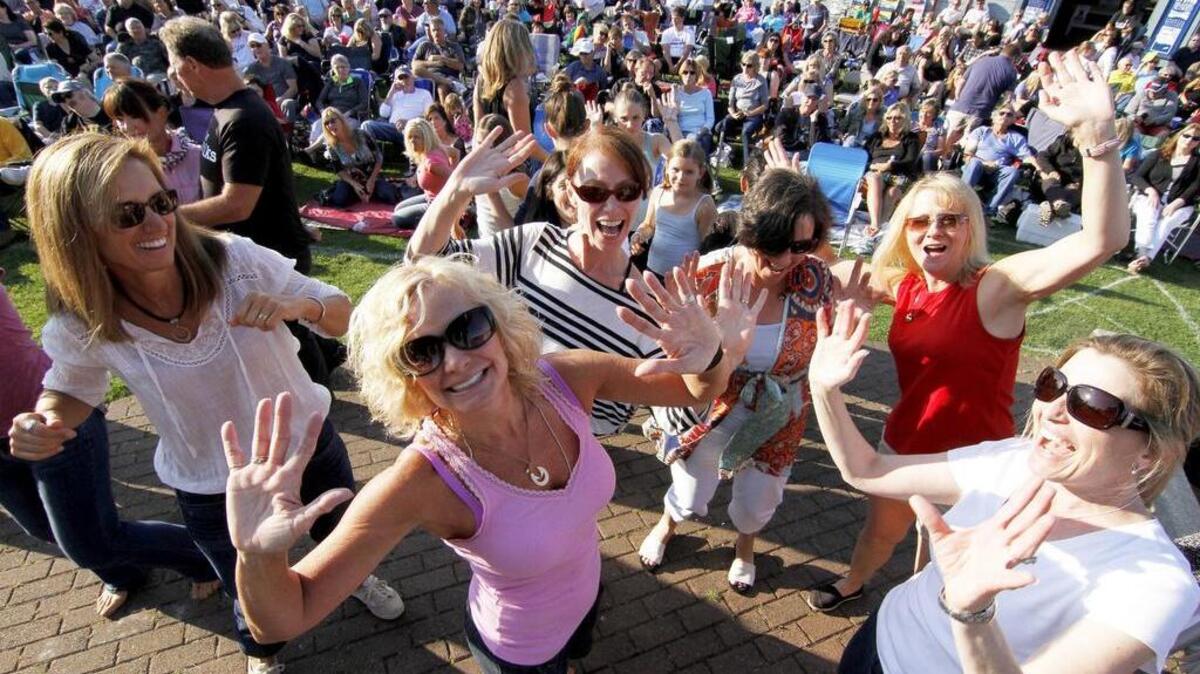 Ladies in the audience dance to the music of The Beatniks. The band is scheduled to perform July 18 as part of the Summer Sounds at Skansie 2017 concert series.