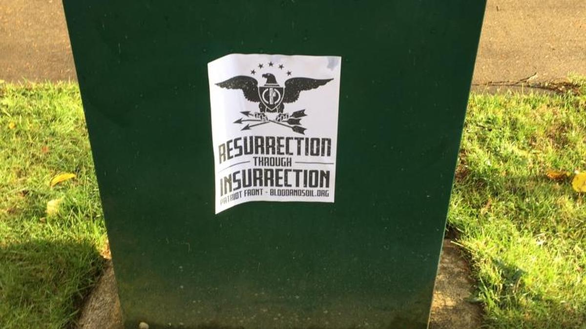 A flier from a group called Patriot Front is found on an utility box near the Tom Taylor YMCA.