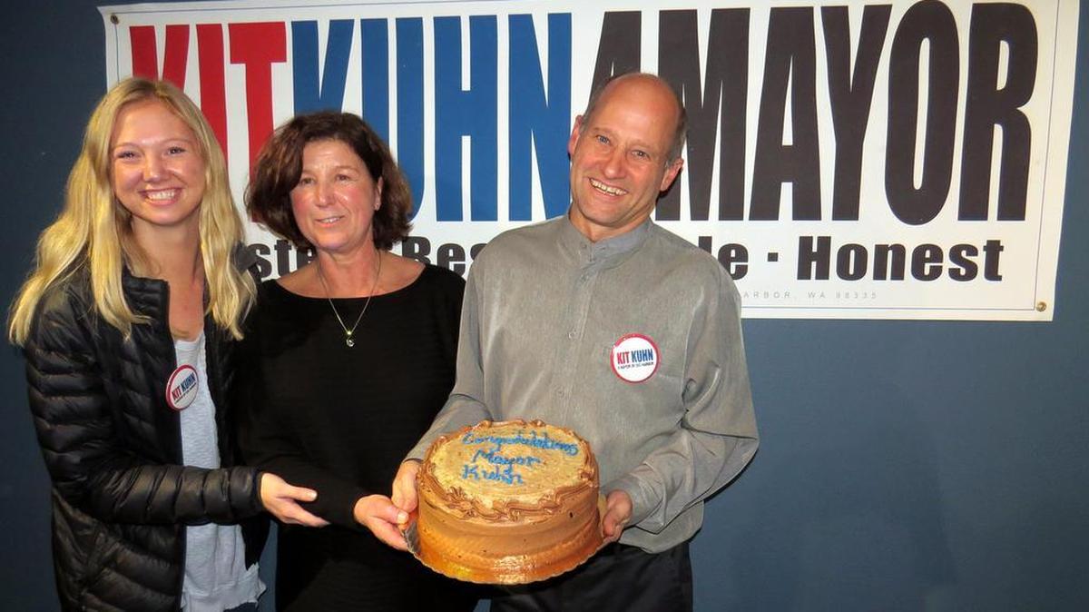Gig Harbor Mayor-elect Kit Kuhn celebrates his win with wife Kathy and daughter Zoey during a celebration at the Gig Harbor Marina and Boatyard on Election Night.
