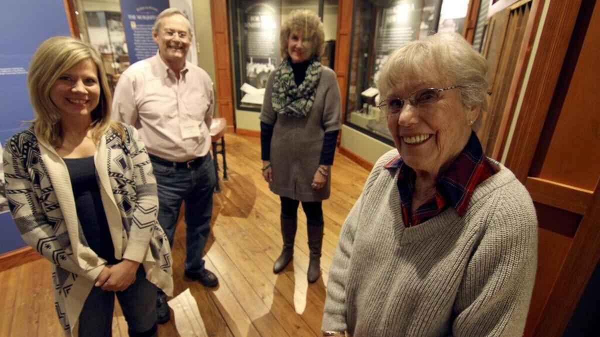 Harbor History Museum volunteer coordinator Sarah Till, left, along with volunteers Quentin James, Leann O’Neill and Rosemary Ross have dedicated years and their love of the Harbor into their work at the facility.