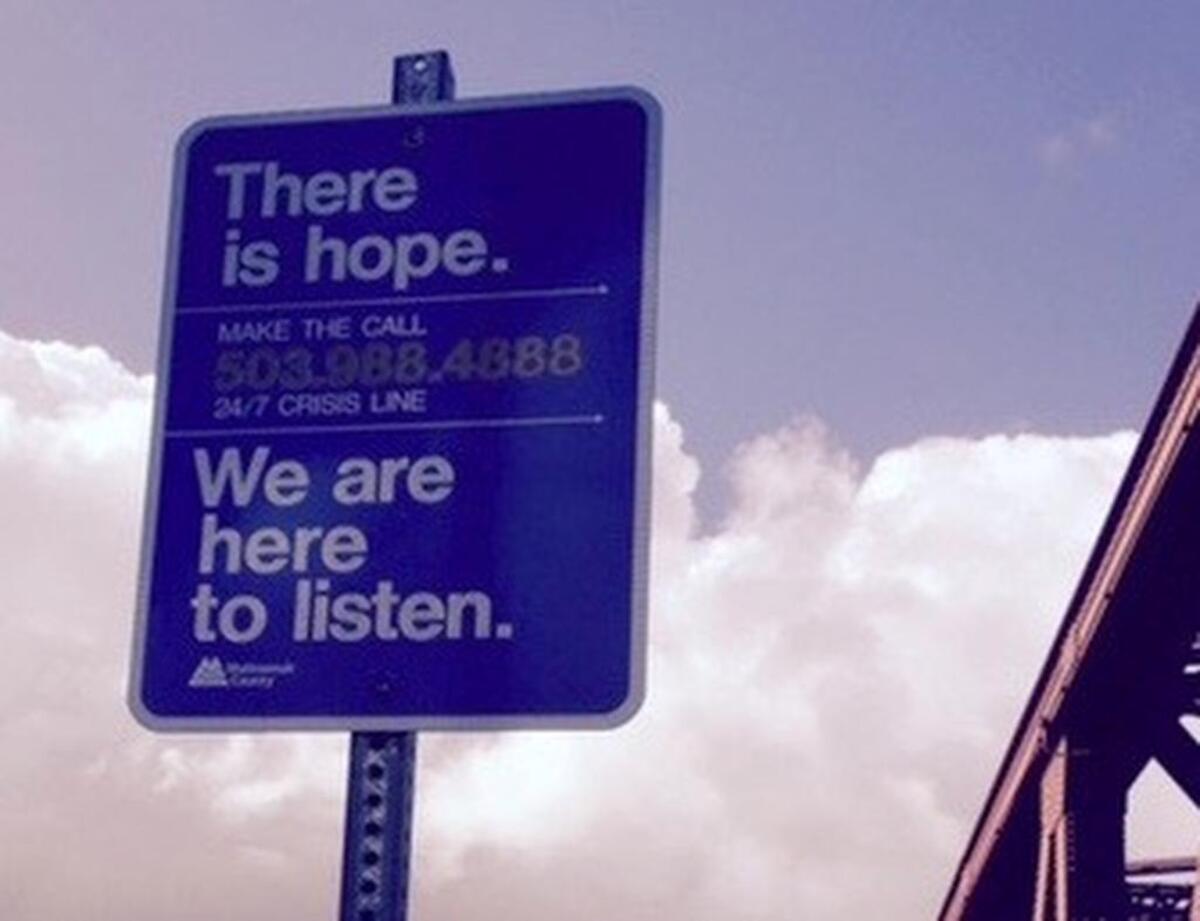 Gig Harbor Suicide Prevention Coalition and the local Rotary Club are working together to bring signs like this one, seen here on a bridge in Portland, to the Tacoma Narrows bridges.
