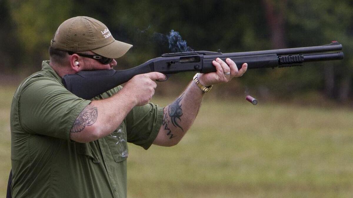Matt Gordy, with SAFE Boats International, fires at a clay pigeon during the Pull for a Soldier event at the Gig Harbor Sportsmans Club on Sept. 15.