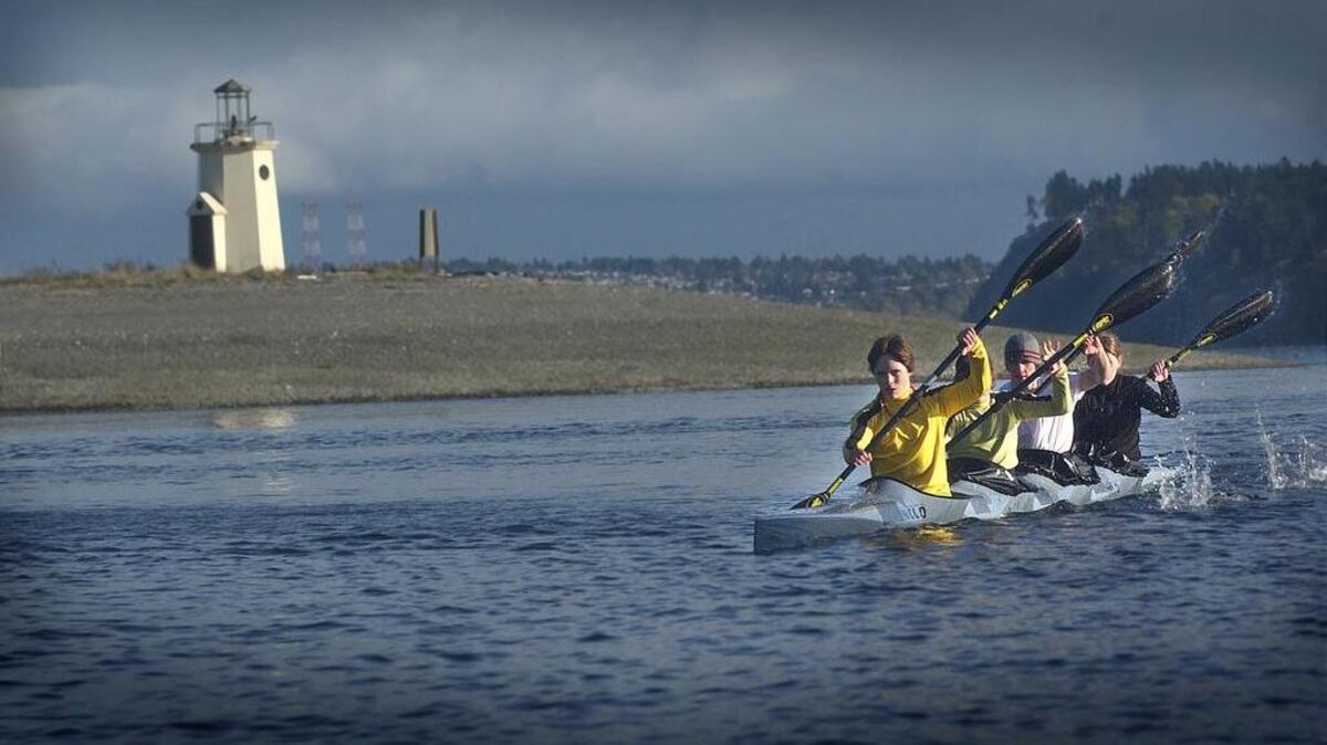 Kayakers paddle past the Gig Harbor sandspit.