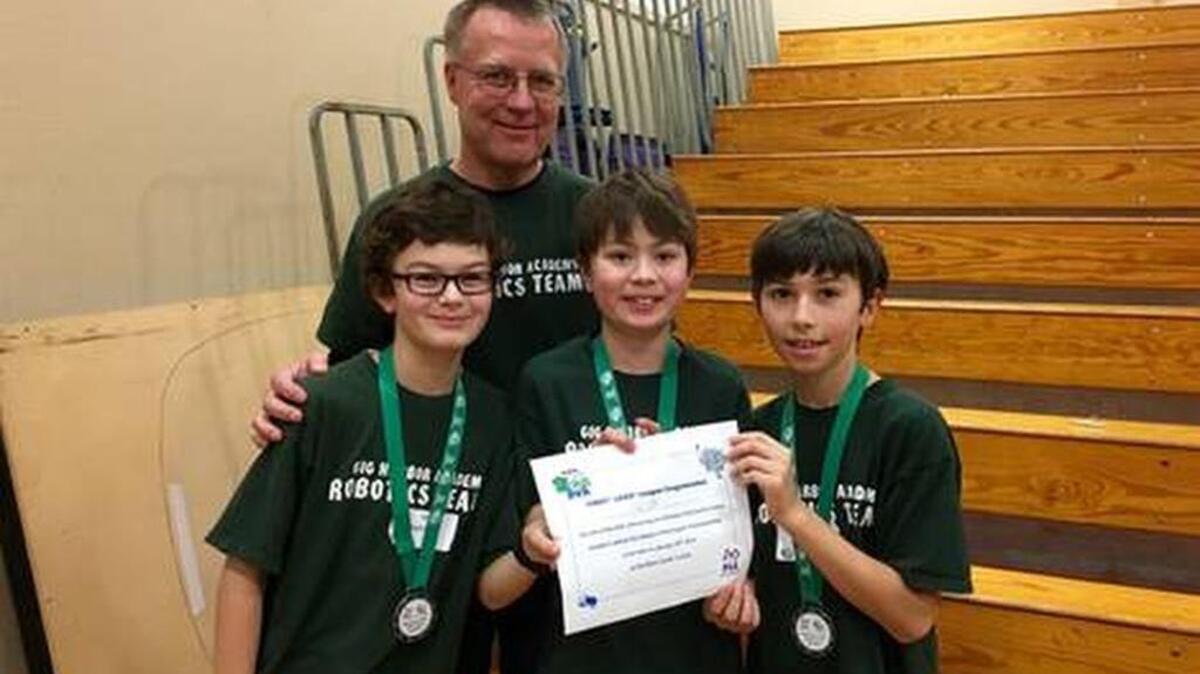 Gig Harbor Academy’s Eagles Force 3 team is the first robotics team from the school to advance to the state finals for the Western Washington State Regional First Lego League Tournament. The team consists of teacher Jeff Funk, Aidan McDougall, left, Kodiak Bear, center, and Reed Karegenow.