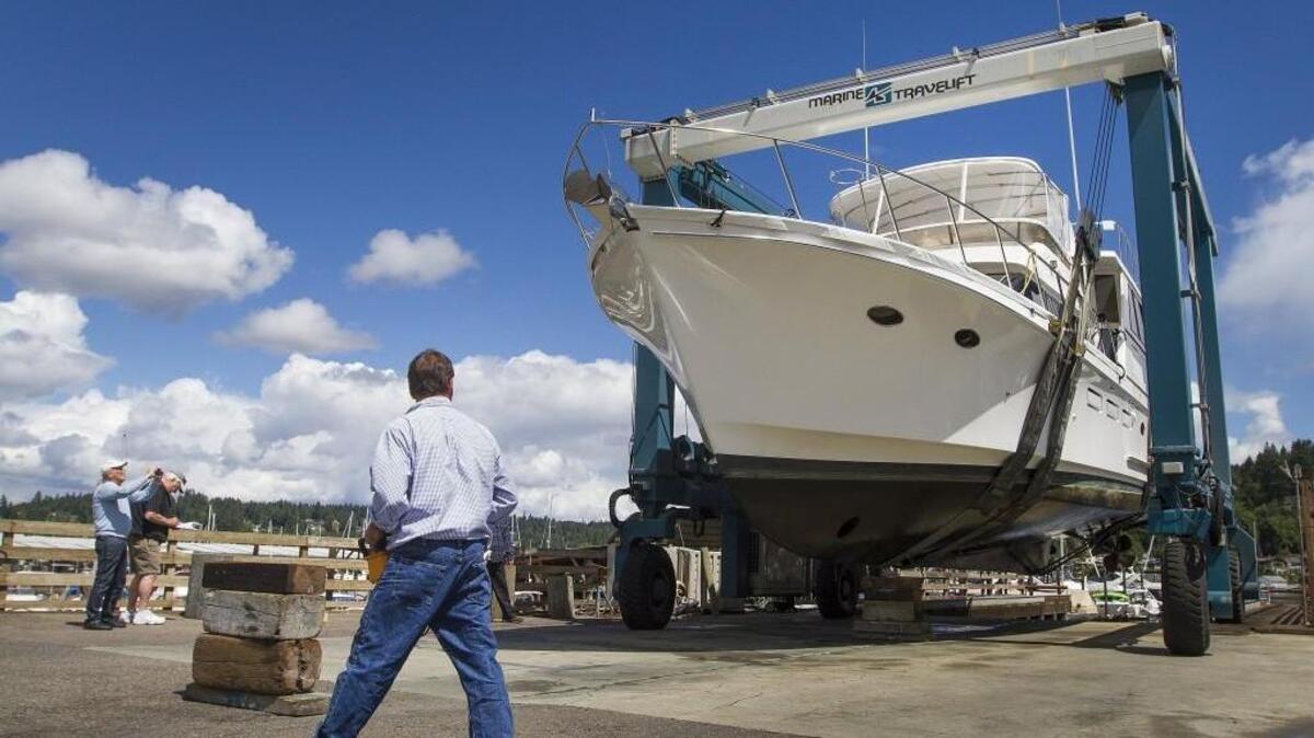 Travel Lift operator Mark Rybin maneuvers a 58-foot-long yacht into the Gig Harbor Marina & Boatyard last week.