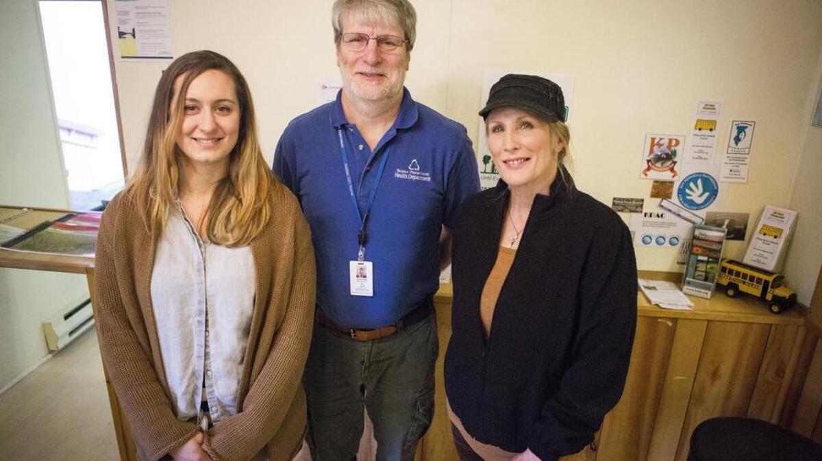 From left: Health Promotion coordinator Gabe Moaalii, Environmental Health specialist Robert Suggs and volunteer Lisa Larson gather at the new Tacoma-Pierce County Health Department office in Key Center.