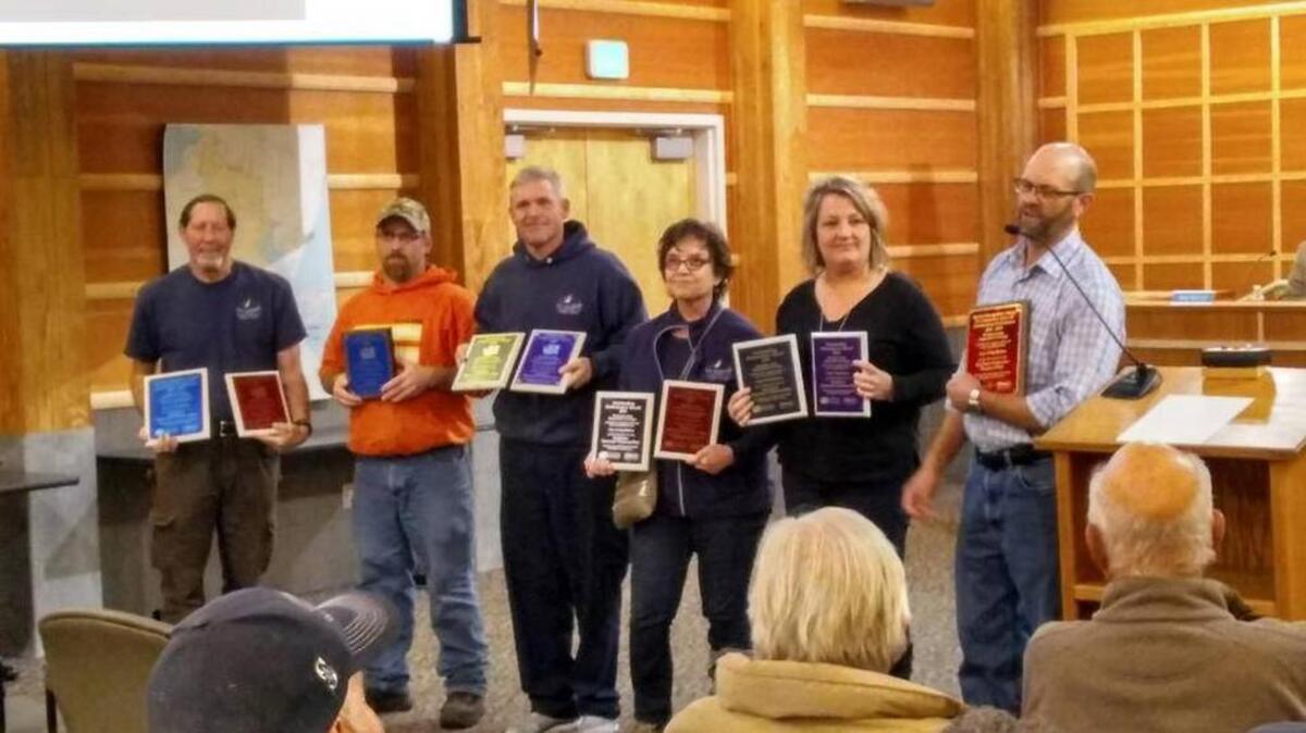 Wastewater treatment supervisor Darrell Winans, right, along with staff from the plant accepts the department’s 10th outstanding performance award from the Washington State Department of Ecology during a Gig Harbor City Council meeting last year.