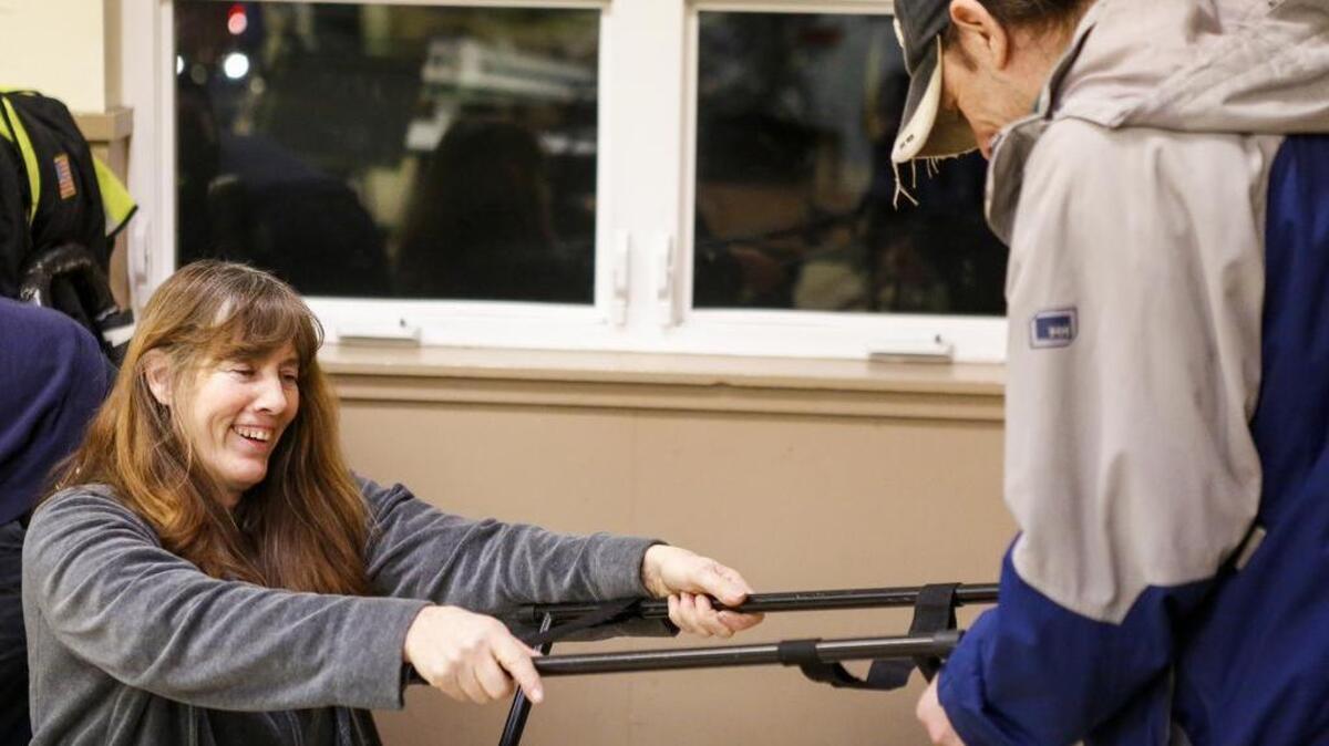 Linda Brewer works with a volunteer to set up the sound equipment at the Tacoma Rescue Mission in Tacoma. Brewer is a longtime member of Chapel Hill Presbyterian Church in Gig Harbor and has been leading a team of volunteers to provide outreach to Tacoma’s homeless every Friday night for almost 20 years, serving anywhere from 200 and 300 people every visit.