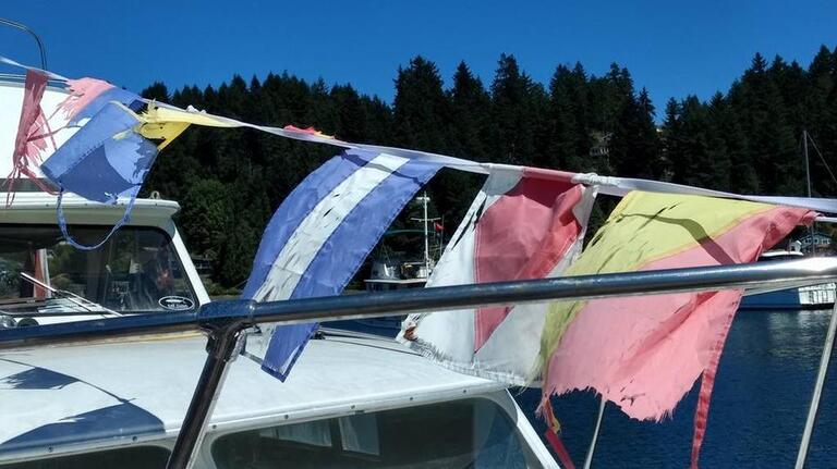 Boats are required to fly these flags under WA state law. Here’s what they mean