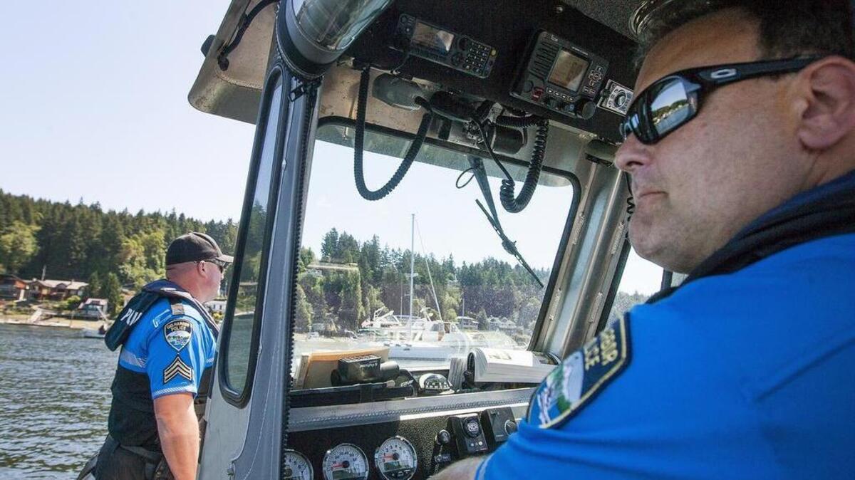 Sgt. Matt Dougil, right, and Sgt. Gary Dahm patrol the waters of Gig Harbor from aboard the police department’s 21-foot-long SAFE Boat during the Blessing of the Fleet ceremony on Sunday.