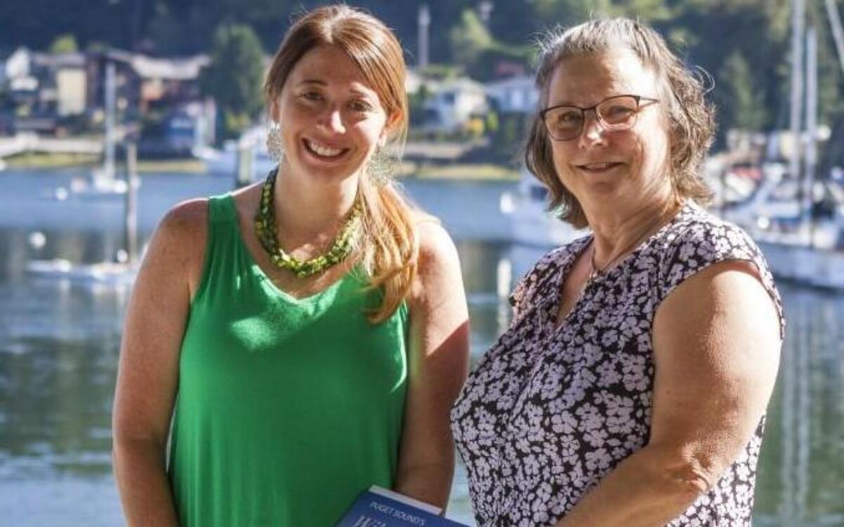 Lindsey Johnson, executive director of Harbor WildWatch, left, stands for a portrait with Eddie Clark of the Gig Harbor Welcome Club. The club recently made a $750 donation to the Gig Harbor-based nonprofit.