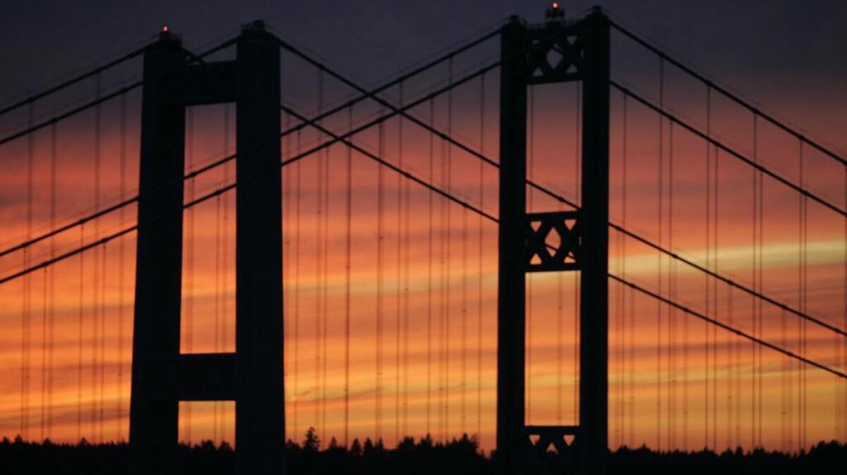 Tacoma Narrows Bridges at sunset as seen from the Tacoma, or east side of the Narrows waterway.