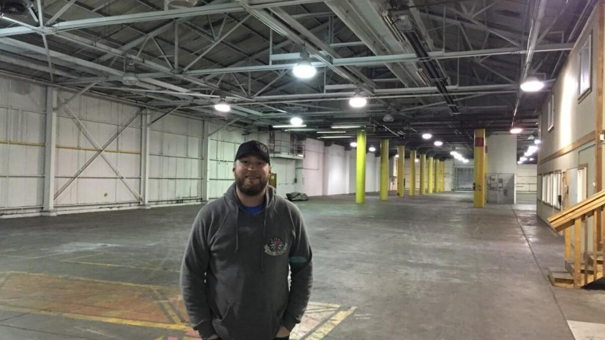 7 Seas co-owner Mike Runion stands in the bottom floor of the 80,000-square-foot building the company recently purchased in downtown Tacoma, which used to be the Heidelberg Brewery, before it closed in 1979. The taproom will be on the top floor and is expected to open to the public in late spring or early summer.