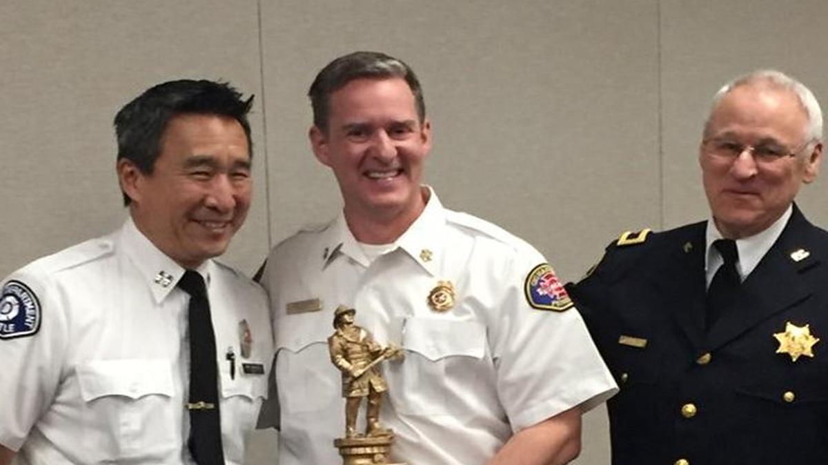Chief John Burgess, center, was awarded the 2016 Chief of the Year award from the Tacoma-Pierce County Chaplaincy during an April 15 ceremony.