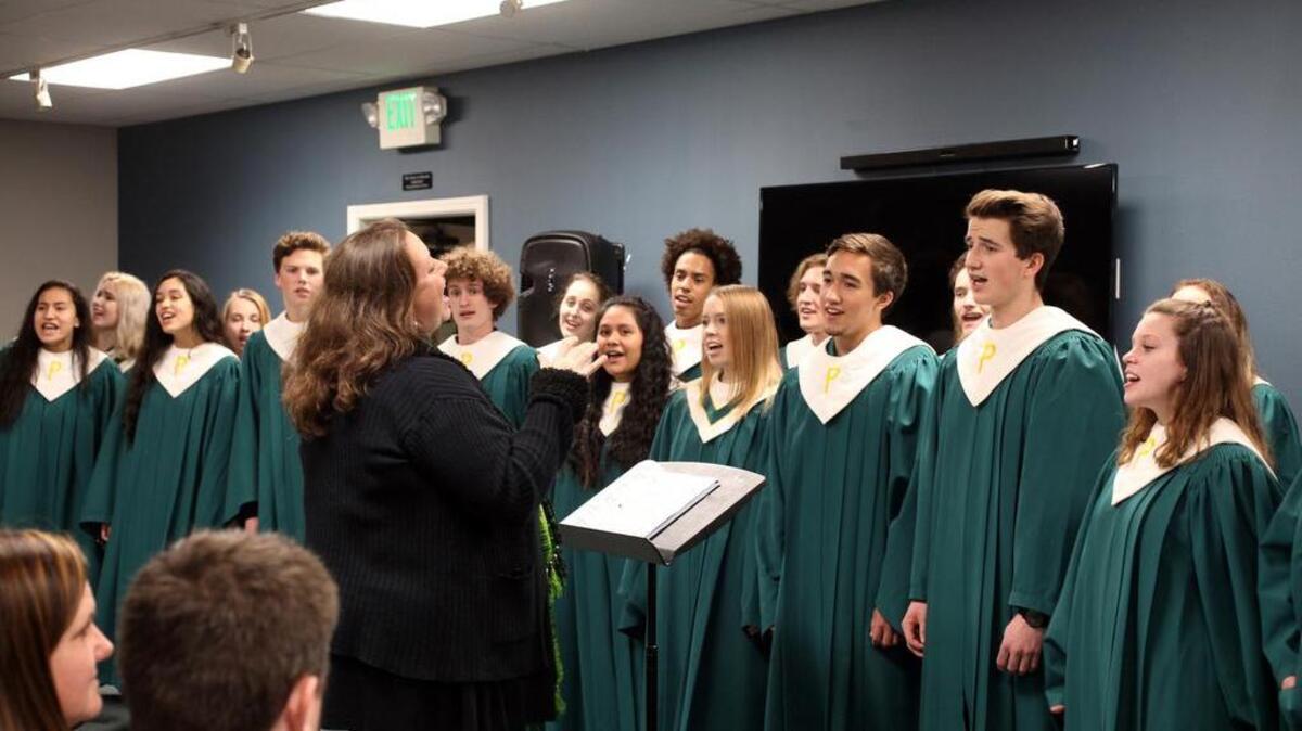 The Peninsula High School Advance Chamber Choir, led by Alison Ellis, sings “Free” by Brian Tate.