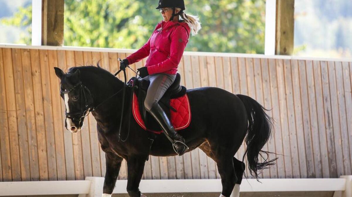 Christine Erikson practices with Allegria at Starr Valley Farm on the Key Peninsula on Oct. 12.