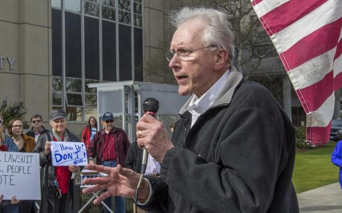 
Jerry Gibbs of Gig Harbor addresses a small crowd outside the County-City Building in Tacoma, March 10, 2015. Gibbs is now an interim Peninsula School District board member.
