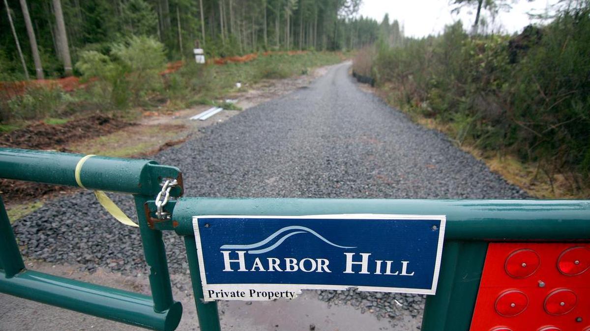 A gate along Borgen Boulevard protects the soon-to-be Harbor Hill neighborhood development as logging crews are harvesting the timber on the site near Gig Harbor North.