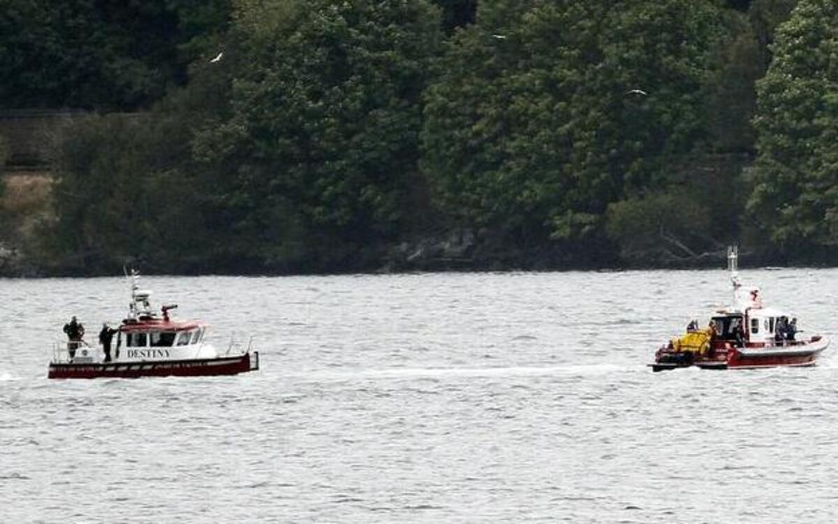 
Members of both law enforcement and fire department marine services units were in and on the waters under the Tacoma Narrows bridges Thursday, Aug. 20, 2015 to recover the body of a male who jumped from the south side of the bridge into the water below.

