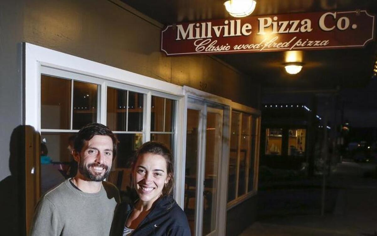 Owners John and Alyssa Ross outside of their new restaurant, Millville Pizza Company, in Gig Harbor.
