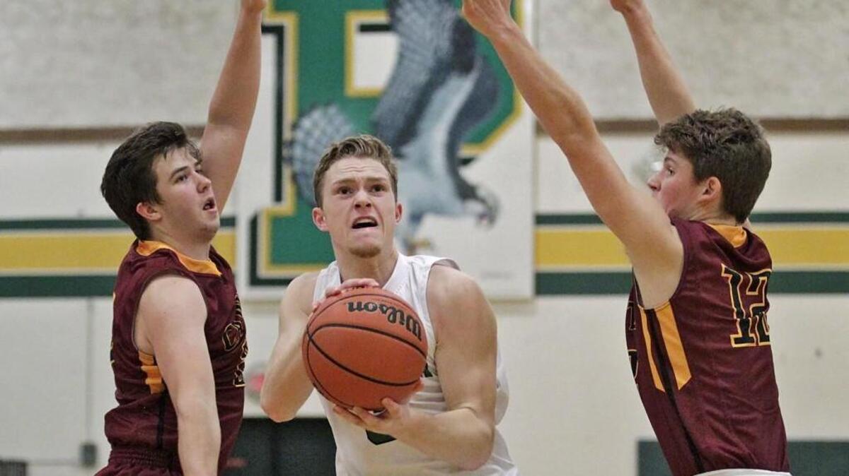 Peninsula guard Sam Miller (3) drives to the basket against Capital in last Friday night’s game in Purdy.
