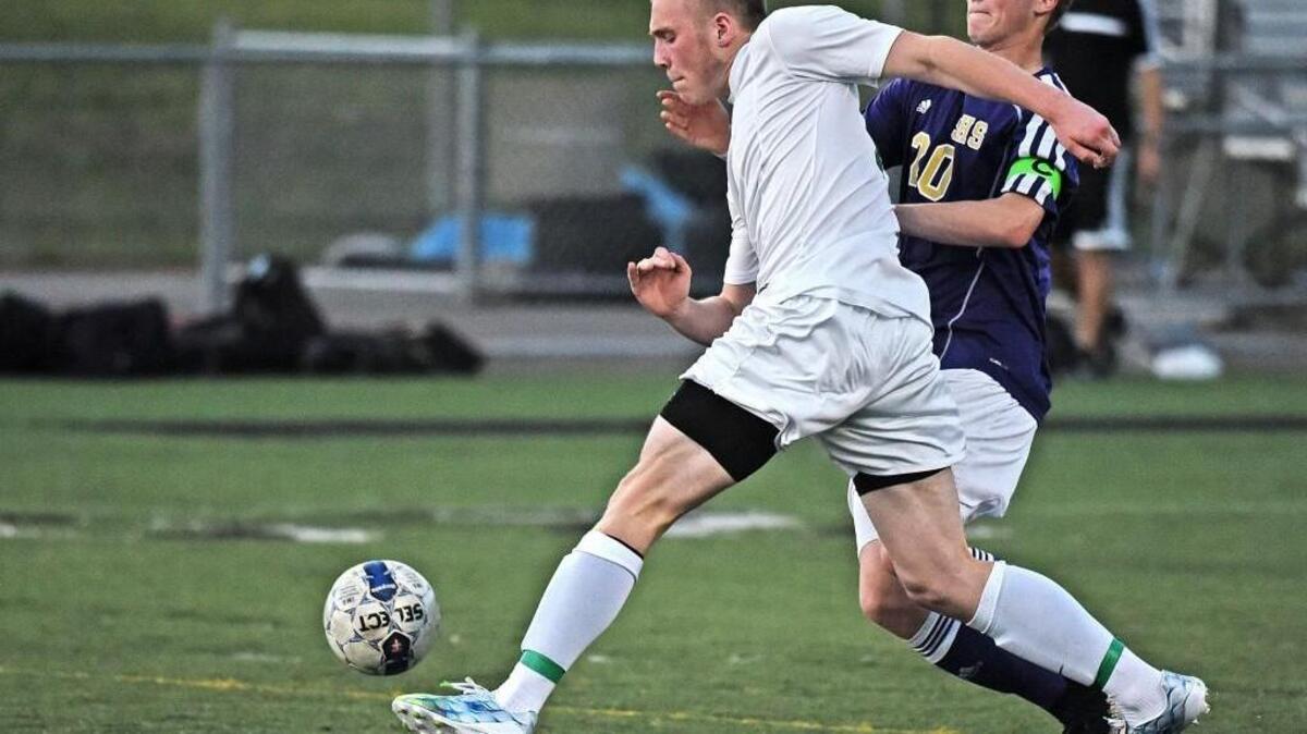 Peninsula's Bradley Keller (white jersey), now a senior center back, anchors a strong back line for the Seahawks this season.