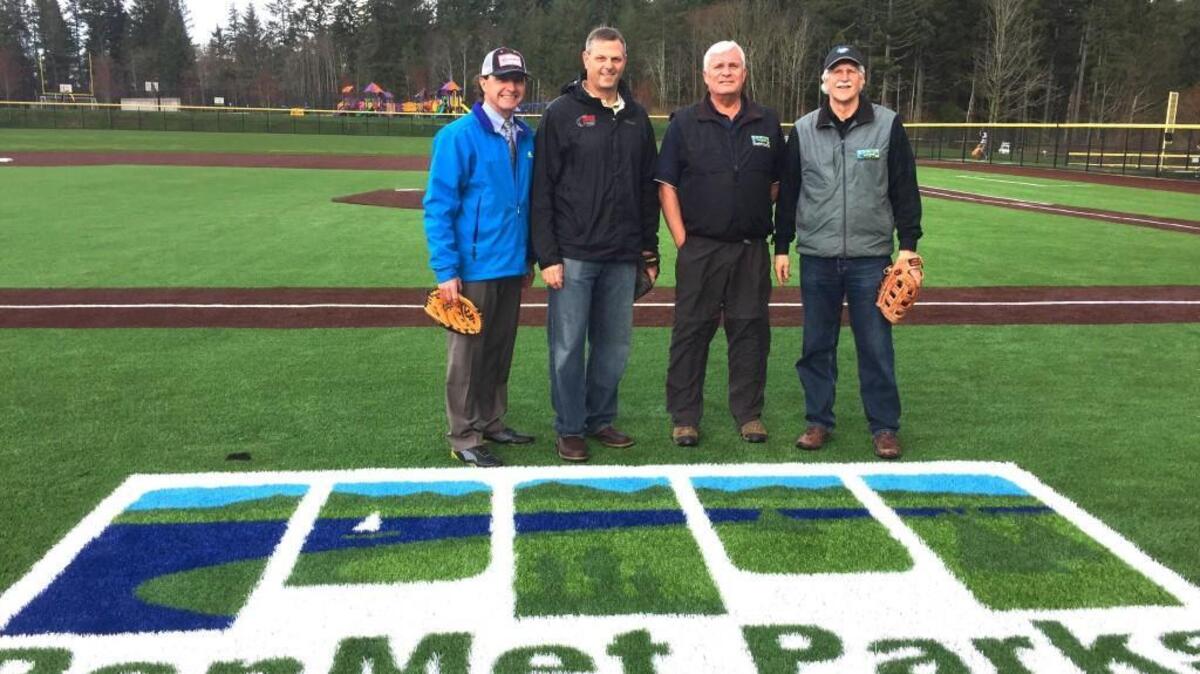 From left, Kurt Grimmer, Steve Nixon, Terry Lee and Eric Guenther of PenMet Parks were on hand last week at Sehmel Homestead Park to celebrate the new turf infields that were recently completed.