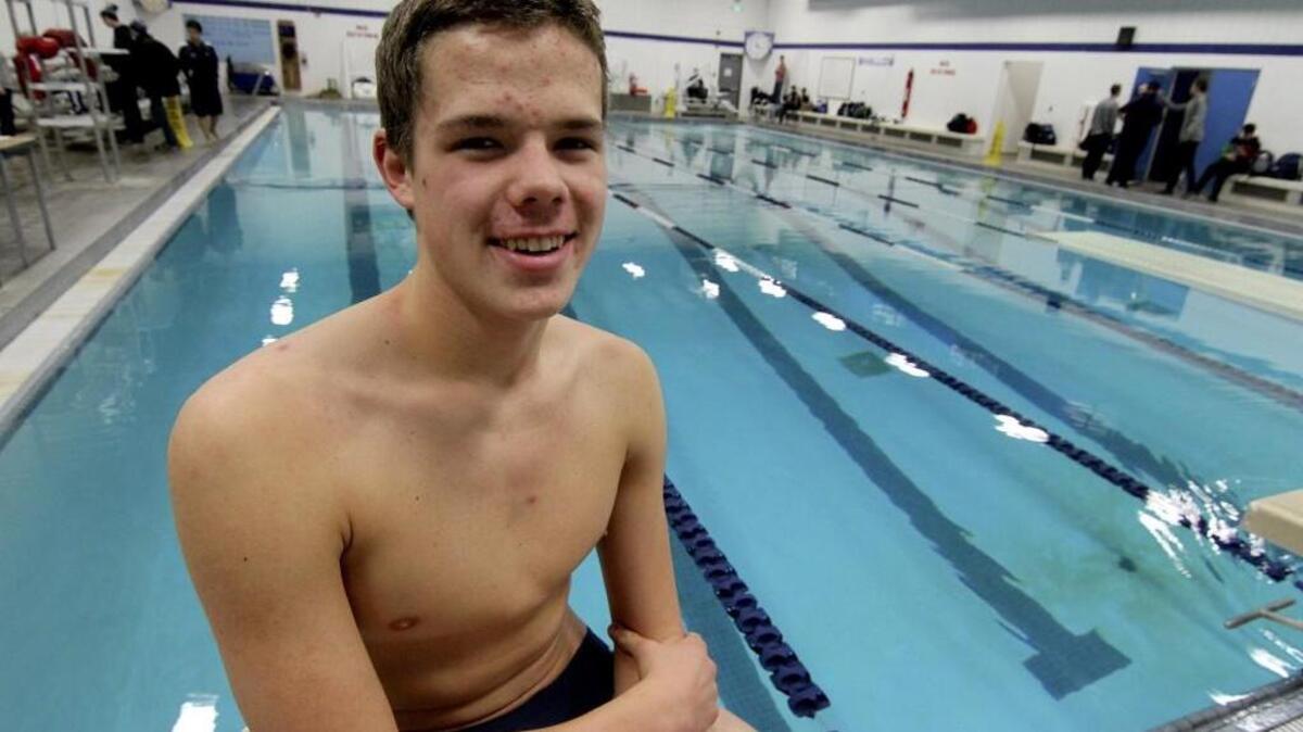 Ryan Grady draws motivation from the records and banners posted inside the Gig Harbor High pool.