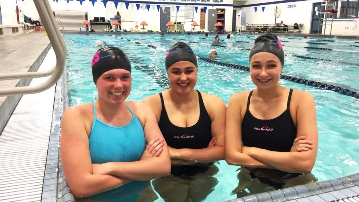 From left, Gig Harbor High School swimmers Megan Hanson, Tatum Benson and Jenna Anderson hope to make this season a successful one for the Tides.