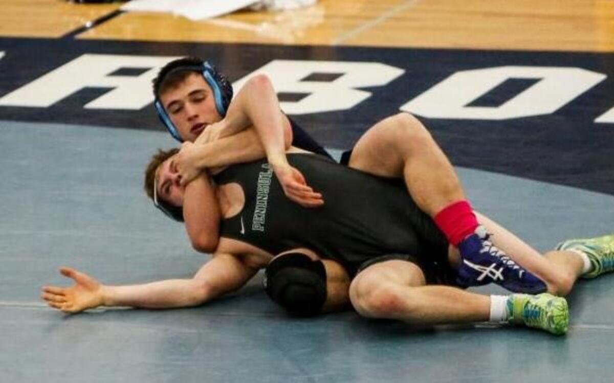 Gig Harbor's Zayne Ball holds Peninsula's Isaac Casey during their wrestling match last Thursday night. Ball won by technical fall.