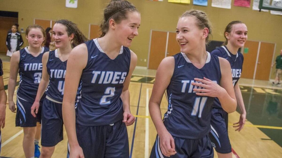 Kendall Liberty, from left, Anna Stewart, Tate McReynolds, Abby Emery and Brynna Maxwell of Gig Harbor laugh and relax after Gig Harbor beat Timberline, 62-46.