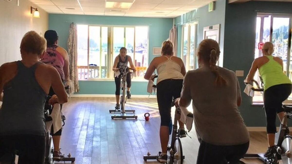 Cycling and strength class, which features 30 minutes of cycling and 30 minutes of weight lifting and strength training, is one of the most popular class offerings at Harbor Fit gym.