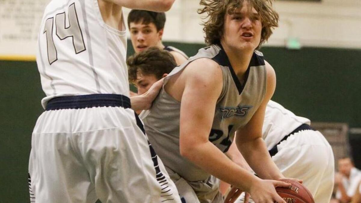 Gig Harbor’s Drew Parrish drives to the basket in the first quarter of last year’s district playoff game against Kelso.