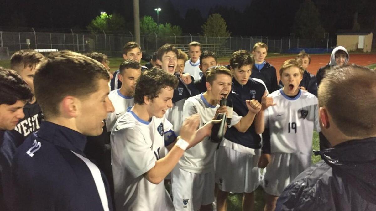 Gig Harbor’s players celebrate after knocking off Squalicum in the opening round of the Class 3A state tournament.