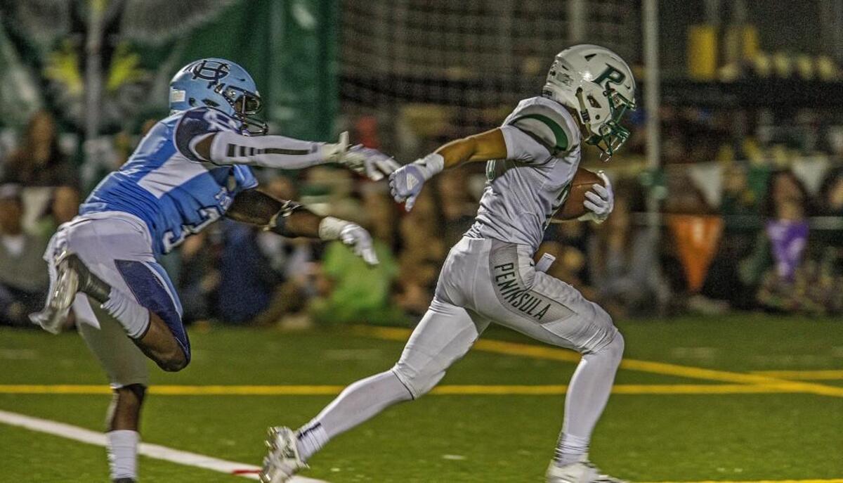 Peninsula running back Michael Foreman (29) is lauded by his teammates and coaches for his vision and ability to make opponents miss.