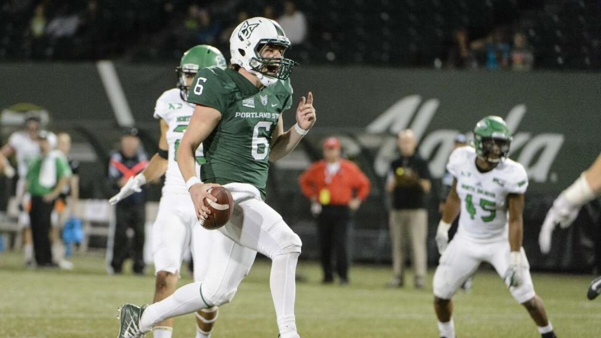 Portland State Vikings quarterback Davis Alexander (6) celebrates as he scores a touchdown during the second half against the North Dakota Fighting Sioux.
