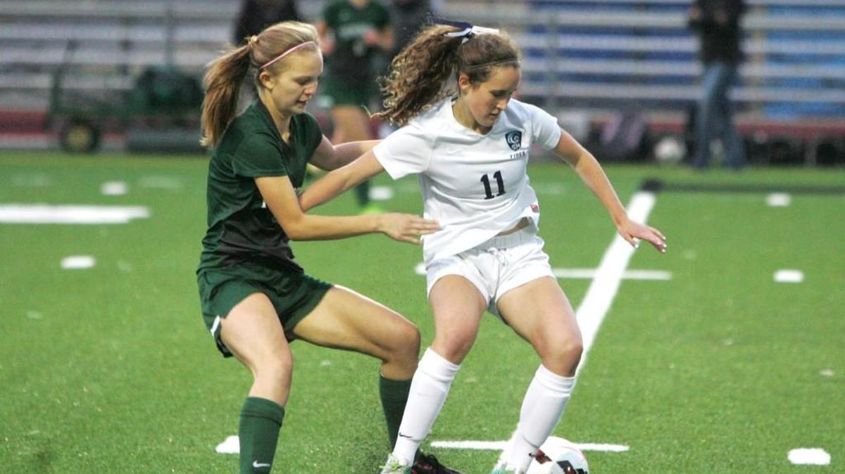 Gig Harbor's Anna Stewart fends off a Peninsula defender on Tuesday, Sept. 19 at Roy Anderson Field. Gig Harbor won, 1-0.