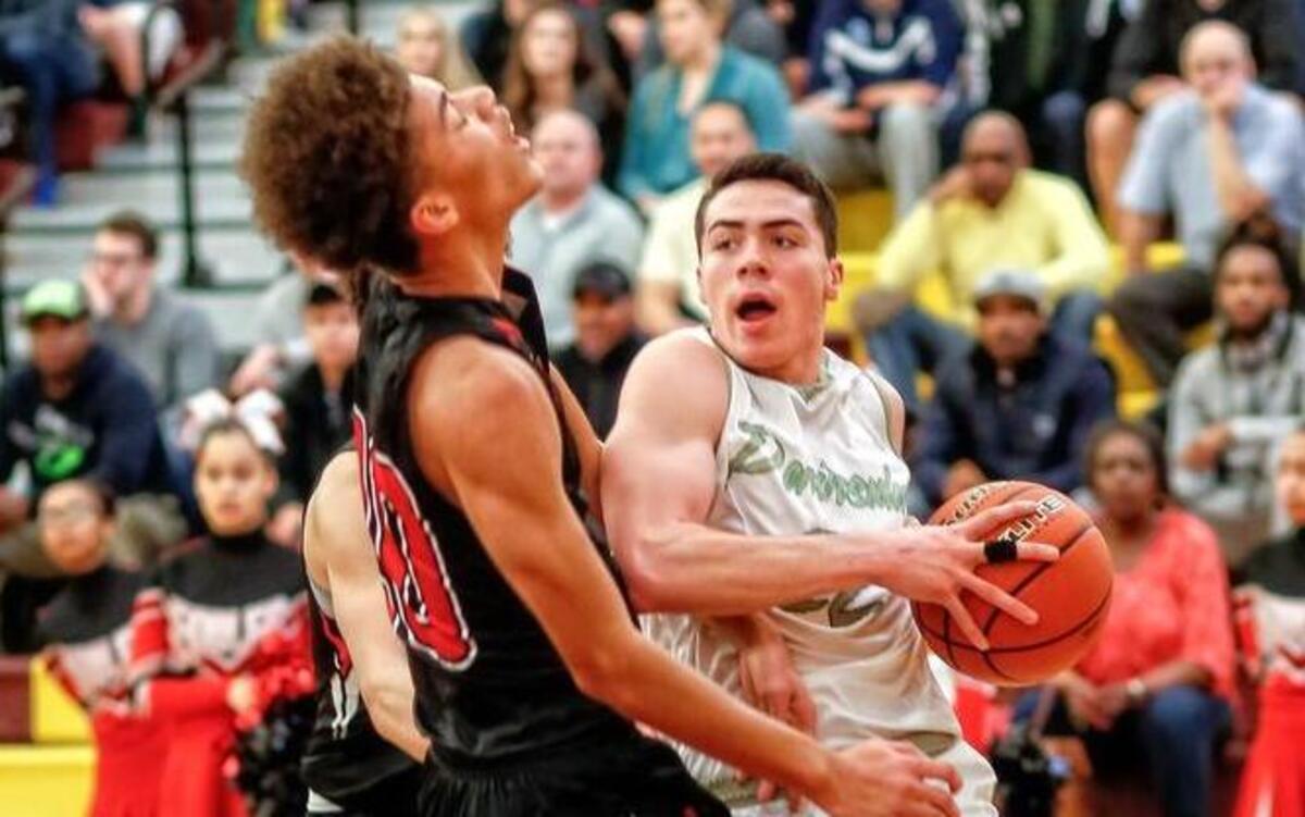 Peninsula guard Garrett Kingman drives to the hoop against Cleveland on Saturday in the regional round of the Class 3A state tournament.