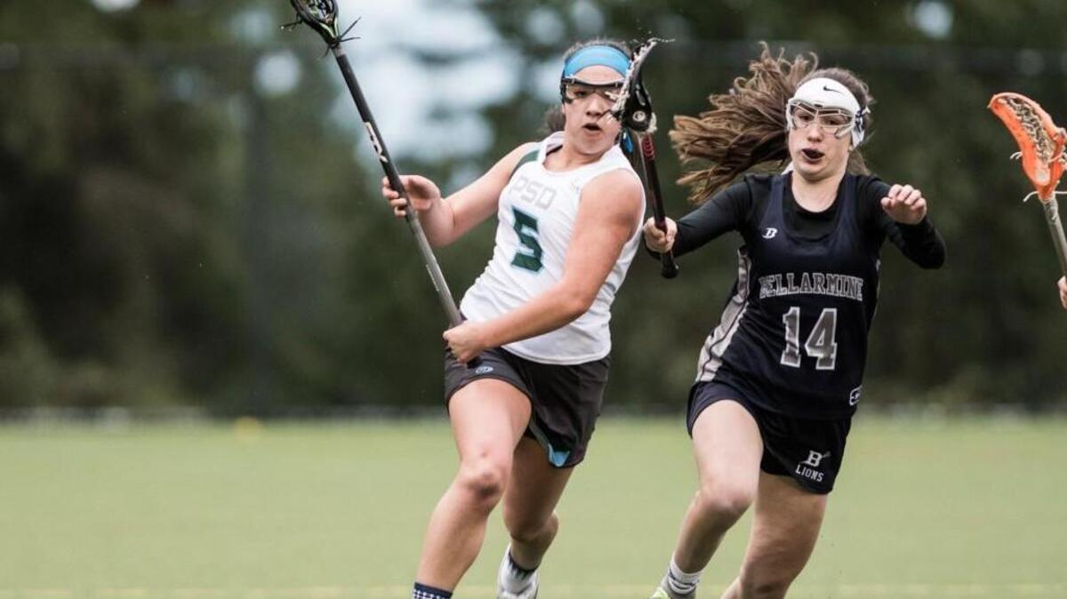 Peninsula School District lacrosse player Julieta Ortiz-Bustillos advances the ball in a game against Bellarmine this season.