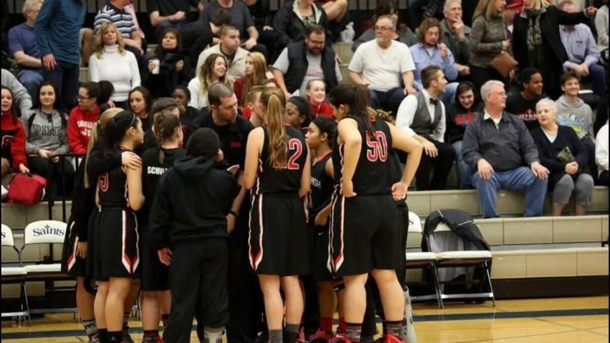 New Peninsula High School girls hoops coach Mike Schick talks to players at his previous coaching stop in Sammamish, where he helped revitalize the program.