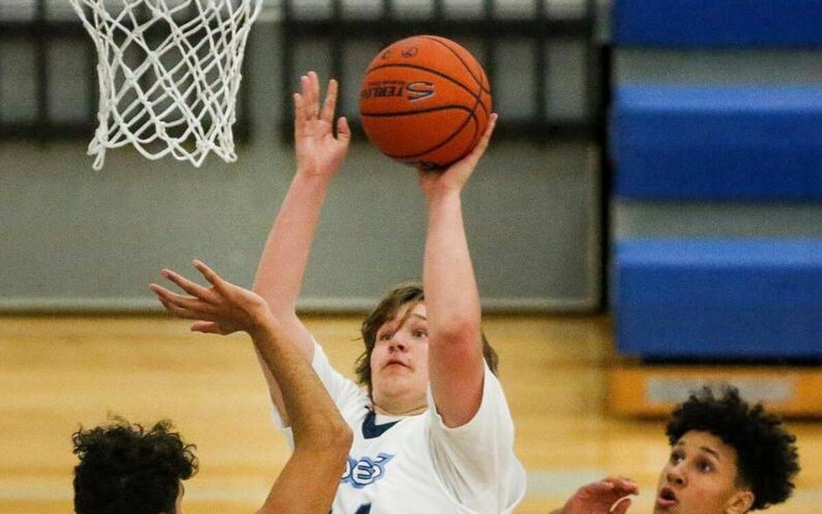 Gig Harbor freshman Drew Parrish (24) has made an impact this season as a role player for the Tides with his quick lefty hook shot and good footwork in the post.
