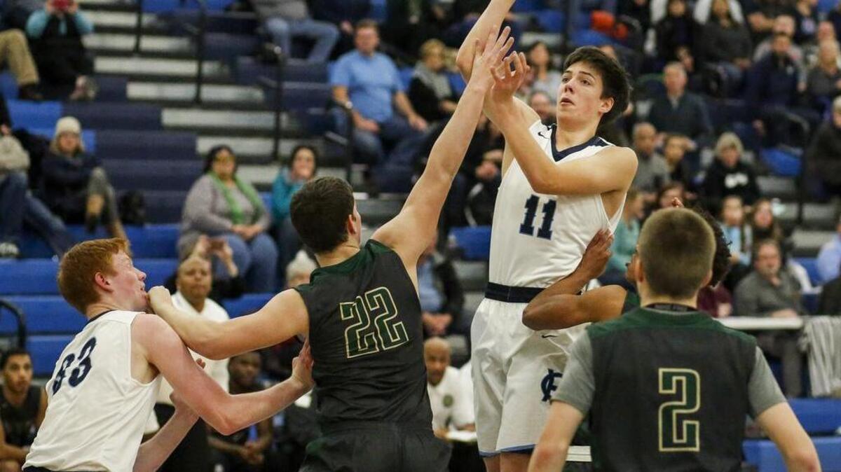 Gig Harbor’s Marcus Oman (11) puts up a shot in the first quarter. Gig Harbor High School played Timberline High School in a basketball game at Gig Harbor High School in Gig Harbor, Wash., on Wednesday, January 4, 2017.