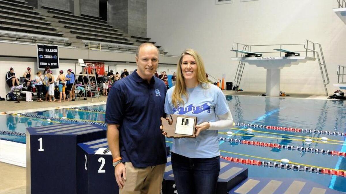 Gig Harbor High School swim coach Mike Kelly with Hall of Fame inductee Jackie (Lobdell) Mowery at the Class 3A state swim meet at King County Aquatic Center.