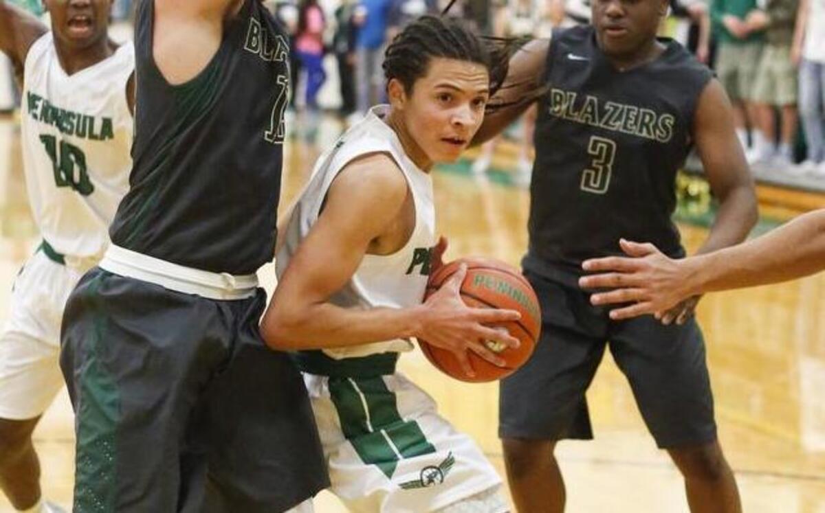 Peninsula’s Elijah McLaughlin (2) drives through multiple defenders trying to get to the basket in the second quarter. Peninsula High School played Timberline High School in a basketball game at Peninsula High School in Purdy, Wash., on Wednesday, December 7, 2016.