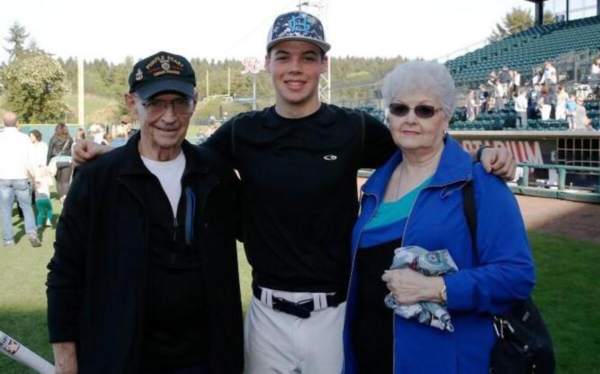Gig Harbor High School and South Kitsap played at Cheney Stadium last year honor 48 fallen soldiers in a Tribute to Our Troops game. Gig Harbor’s Logan Gerling awards the parents of fallen soldier Sgt. First Class Johnny Walls his game jersey.